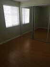 bedroom with full wall mirrored closet - 616 Veteran Ave