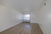 2BR, 1BA - 850SF - Living Room - The Courtyard Apartments