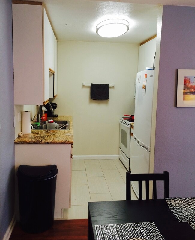 Marvel countertops in the kitchen sit on all new White appliances including a dishwasher - 970 Palm Avenue Unit 107