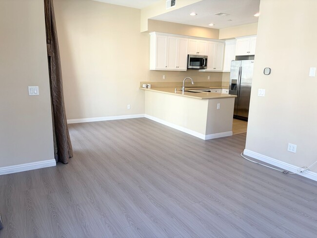 Photo - Stylish 3-Story Townhome with Balcony & Open-Concept Living