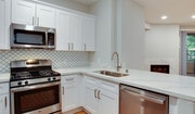Select kitchens offer stainless steel appliances and quartz countertops - The Villas at Park La Brea
