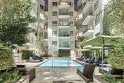Our outdoor pool offers a quiet retreat from the city - Olympic by Windsor Apartments