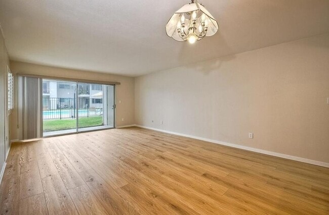 Building Photo - First-Floor 2BR Condo with Pool Access & Covered Parking in La Bonita Unit 107