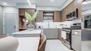 Griffis Platinum Triangle apartment kitchen with quartz countertops. - Griffis Platinum Triangle