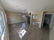 Living and sleeping area with mirrored closet - 6534 Peterson Ave