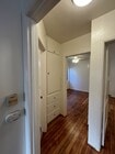 Hallway with built-in linen closet - 256 17th St Apartments Unit FRONT