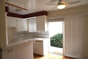 Newly tiled kitchen with stove and large sliding glass doors - 14333 Albers St Unit 3