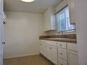 Spacious cabinets and storage in the newly painted kitchen - 4138 Redondo Beach Blvd Apartments Unit A