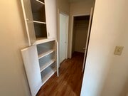 Hallway (deep shelves, and closet) - 147 Genoa St Apartments Unit D