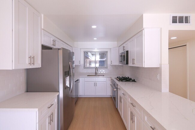 Photo - IN-UNIT LAUNDRY WITH ON-SITE PARKING!! Unit 104