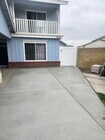 Parking area located on pad in front of big house. - 7431 Warren Cir House