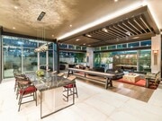 Sophisticated lounge spaces at Modera Argyle feature stylish seating, shuffleboard, and inviting areas to relax, entertain, or connect with neighbors. - Modera Argyle