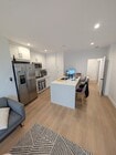 kitchen with stainless steel appliances - 2827 2nd St Apartments