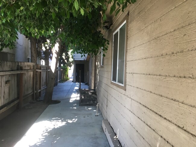 Side yard - 1819 Beloit Ave Unit A