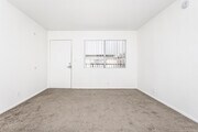 2BR, 2BA - 1,000SF - Living Room - 1375 Temple Ave. Apartments