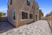 Fully paved side and backyard with modern stone design, perfect for outdoor dining, BBQs, or family - 26549 Brightstone Dr