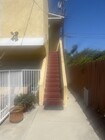 Stairs to Front Door - 1132 N Heliotrope Dr Apartments Unit Upper Duplex