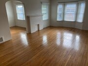 Living room and dining room with ceiling fan. - 449 San Vicente Blvd Unit 4