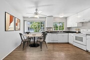 Kitchen and dining area with hard surface flooring - AVA Newport Apartments