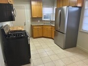 Kitchen: granite and butcher block counters - 2021 Ocean Park Blvd Apartments Unit Front