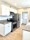 Kitchen with laundry room adjacent and exit to backyard - 10134 Memory Park Ave House