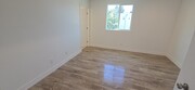 Downstairs bedroom - 10925 Hesby St Apartments Unit 10925