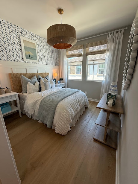 10x10 bedroom, furnished with bed and nightstand. This is virtual staged - 2640 Everly Dr Townhome