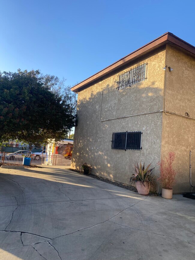 Parking lot/ Side view of building - 2458 S Normandie Ave
