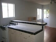 1 Bedroom / 1 Bath Kitchen island/bar and open living space - hardwood floors newly finished - 33 S Venice Blvd Apartments