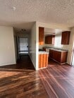 Kitchen with Entrance - 14025 Chadron Ave Apartments