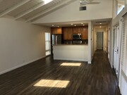 main living area and view of kitchen - 518 Dahlia Ave Apartments Unit 518.5 Back