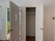 Entrance and coat closet into living room - 4435 12th St Unit home
