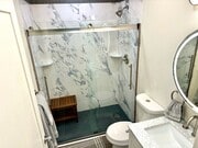 Bathroom with carrara marble. - 3038 E St Apartments Unit E