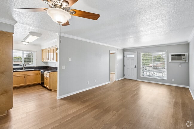 2BR, 2BA - 950SF - Living Room and Kitchen - Highland Pinetree Apartments