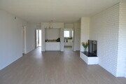 Dining Area and Living Room with Fireplace - The Continental Arcadia Apartments