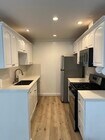 Galley kitchen with new appliances - 1021 5th St Condo Unit 109