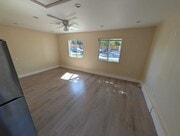 Bright living area with large windows - 6534 Peterson Ave
