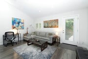 TV seating area next to a Dedicated Workstation - 73 Summerfield St Unit 805 Modern and Private