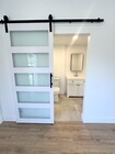 Sliding barn door to bathroom - 7080 Estrella de Mar Rd Condo Unit La Costa Casita