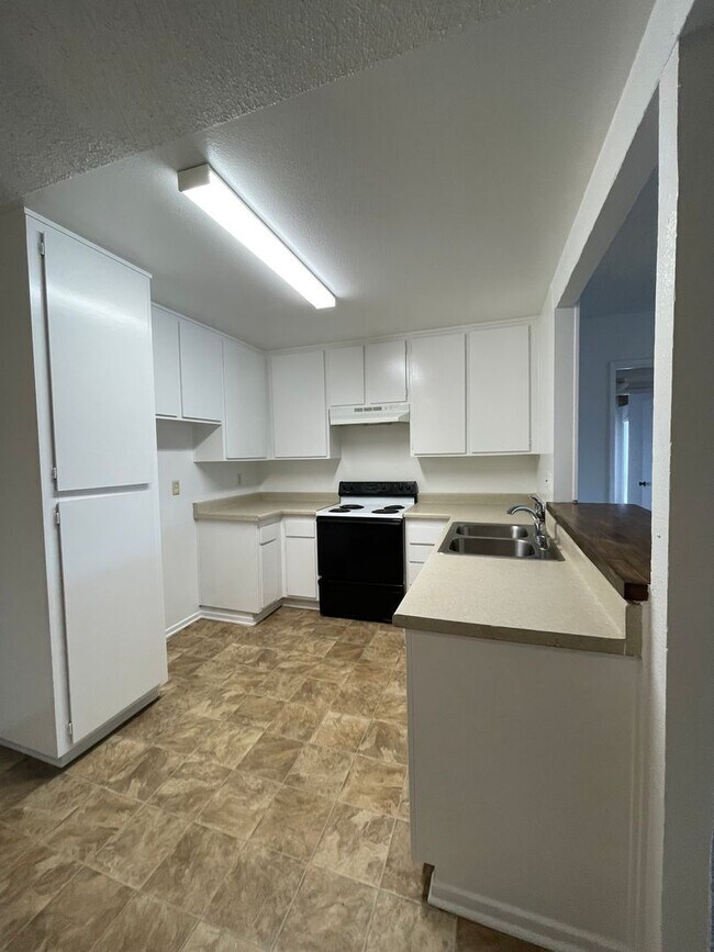 Photo - Spacious 2-bedroom 1-bathroom upstairs condo with Balcony/Garage Unit 1901