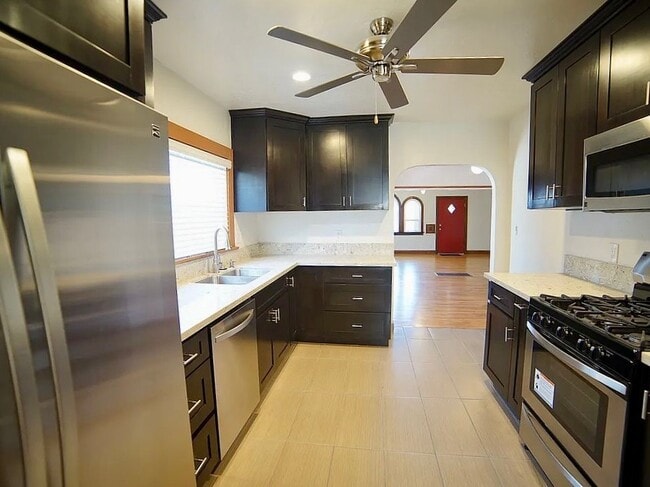 Large and open kitchen with stainless steel appliances. - 3036 E St