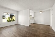 Spacious living rooms, your perfect space to relax, entertain, or unwind. - Palms Apartments