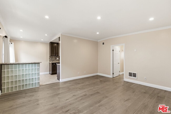 Building Photo - 8710 Belford Ave Unit 207B