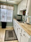 Butcher block counter tops and lots of light. - 4111 Summertime Ln Condo Unit 4111