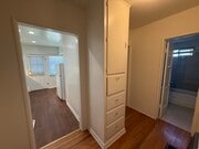 Hall with storage and entries to kitchen and bath. - 1755 Silver Lake Blvd Unit 1755