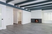 Comfortable family room with fireplace and sliding door to balcony - 133 Anacapa Ave House Unit B