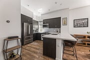 Kitchen and breakfast bar. - 215 Elm Ave