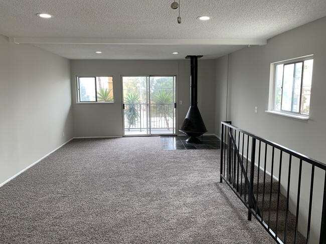 Gas fireplace, balcony and upstairs living room - 813 15th St Unit 813