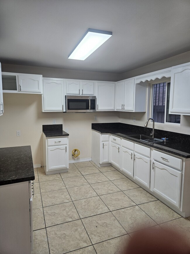 Photo - 8940 Orchard Ave Apartment Unit Back