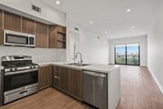 Open-Concept Kitchen, Dining, and Living Room Areas - Cole Grove by Wiseman